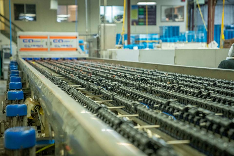 Bottles moving along an enclosed filling line